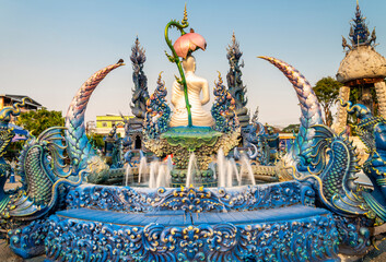 Fountain with dragon statues outside Wat Rong Suea Ten, also known as the Blue Temple,Chiang...
