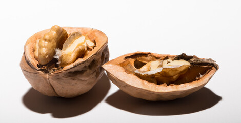 Walnuts are rounded, single-seeded stone fruits of the walnut tree. Cracking a nut.