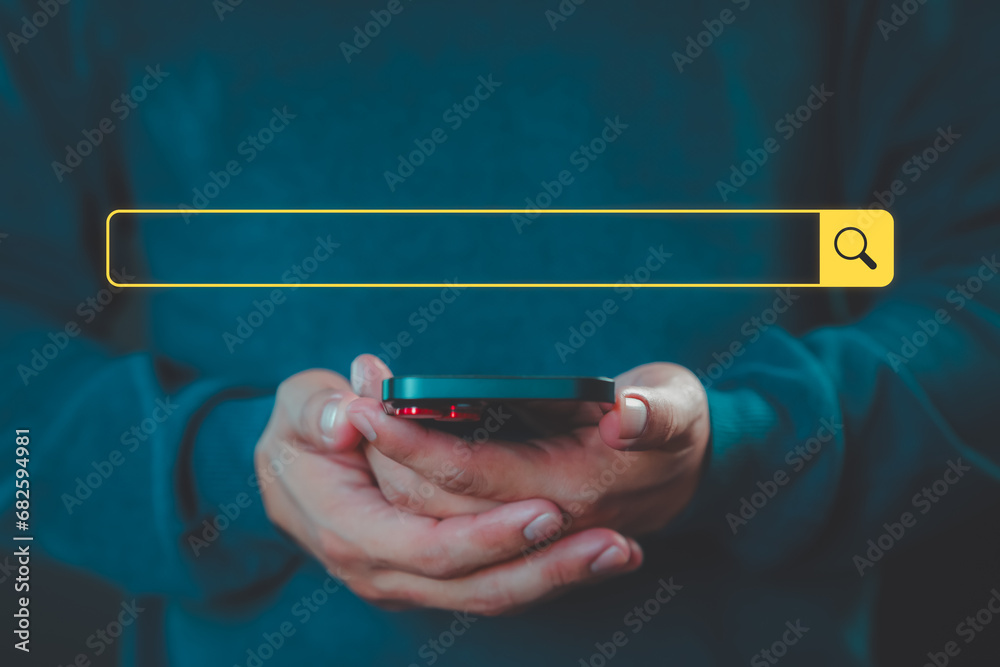 Poster Man using a mobile phone clicking internet search bar. SEO technology networking engine optimization internet with search bar. Searching browsing internet data information concept.