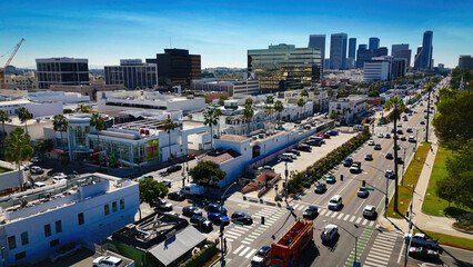 Aerial view over Santa Monica Boulevard in Beverly Hills with a view over the downtown high rise buildings - aerial photography - obrazy, fototapety, plakaty