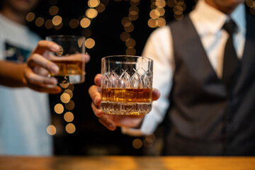 Barman pouring whiskey whiskey glass..