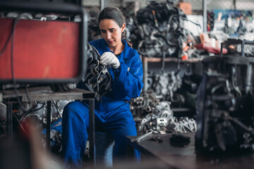 Obraz na płótnie Canvas Car technician check engines, choose quality gear for precise repairs to ensure optimal performance