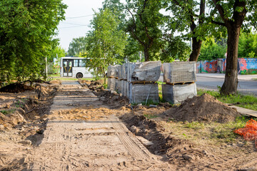 Naklejka premium Preparing a plot of land for laying paving slabs in a park