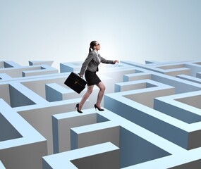 Businesswoman trying to escape from maze