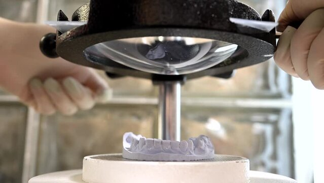 Mouth guard for teeth, printed on a 3D printer in dental clinic laboratory. 4k cinematic slow motion video