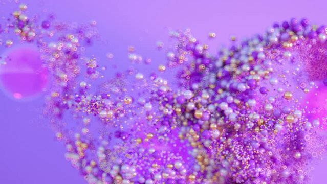 Colorful pearls floating with liquid motion against a purple gradient background in selective focus on a seamless loop