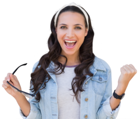Digital png photo of happy biracial woman holding glasses, hands in air on transparent background