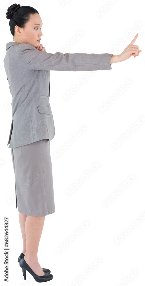 Sticker Digital png photo of focused asian businesswoman pointing with finger on transparent background