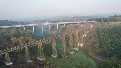 Scenic View of a Passenger Train Passing by Cikubang Bridge Longest Active Train Bridge in Indonesia. 