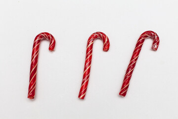 Christmas candy-Santa's striped cane on a white background, isolate. Close up. Christmas, new year. Decoration, sweetness, candy, treats for children.