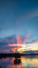 Sunset reflection and clouds in the reservoir