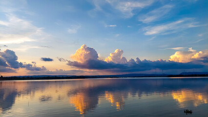 Sunset reflection and clouds in the reservoir