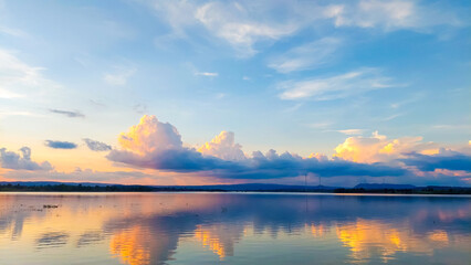 Sunset reflection and clouds in the reservoir