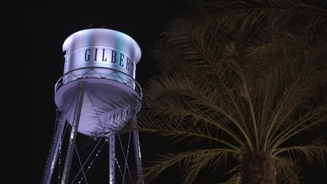 Water Tower Christmas Light Show behind Palm Tree | Gilbert, AZ Water Tower