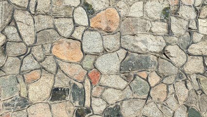 Decorative wall decoration with stone. A stone fence with streaks. Decorative wall decoration with stone. A stone fence with streaks.