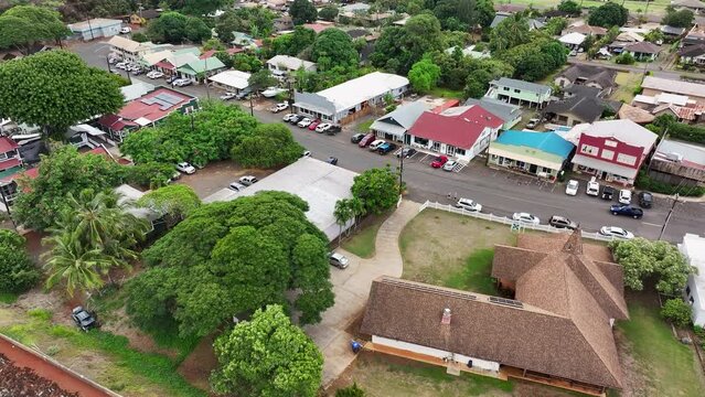 Aerial Kauai Hawaii Hanapepe Swinging Bridge city. Hanapepe River flow Pacific Ocean through historical town. Swinging suspension bridge sways as you cross it. Historically plantation style buildings.