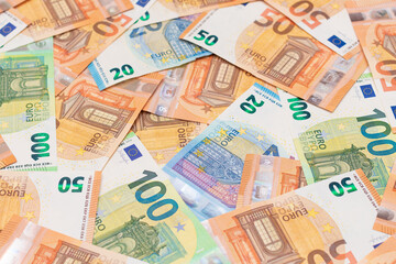 Fototapeta na wymiar Different Euro Banknotes Money Background. Euro Money Currency. Colored Paper Money. A Lot of Fifty Euro Bills. Business, Finances, Cash and Money Saving Concept
