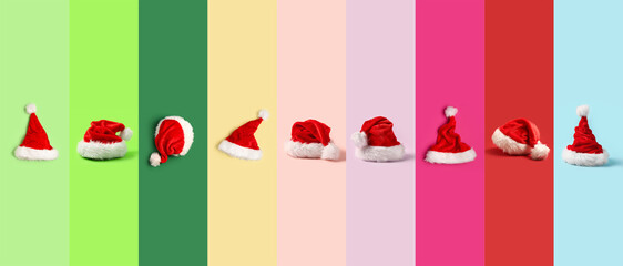 Set of Santa hats on colorful background