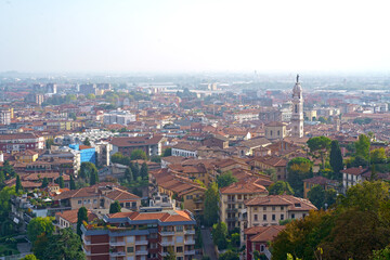 Fototapeta premium Bergamo. One of the beautiful city in Italy. Landscape at the old town from San Vigilio hill. Amazing view of the towers, bell towers and main churches. Touristic destination. Best of Italy