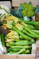 Nice. French market. Fresh zucchini with flowers sold at the market. Zucchini flowers are used in traditional French cuisine