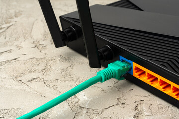 Colored network cable patch-cord on gray textured background