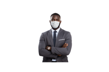 Handsome young businessman wearing a mask stands with his arms crossed and smiles looking at the camera. Isolated on transparent background.