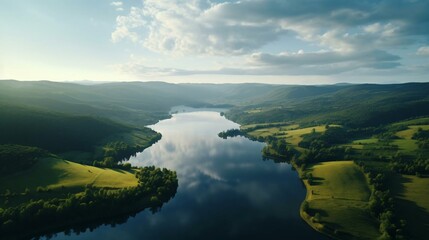 a river surrounded by green hills - obrazy, fototapety, plakaty