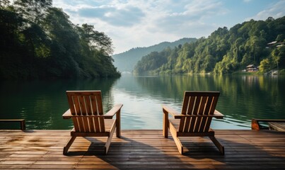 Naklejka premium Two Rustic Wooden Chairs on a Serene Wooden Dock Overlooking the Water