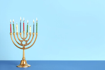 Menorah on color background. Hanukkah celebration