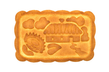 Biscuits with a picture of a country house on a white background. One cookie close-up.