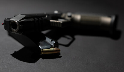 Modern Elegant Handgun and Bullet on Grey Background in Switzerland. - obrazy, fototapety, plakaty
