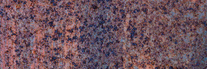 Texture of rusty metal. Rough metal surface with rust. Corroded and oxidized old iron. Rusted and aged metal sheet. Wide panoramic texture for background and design in grunge style.