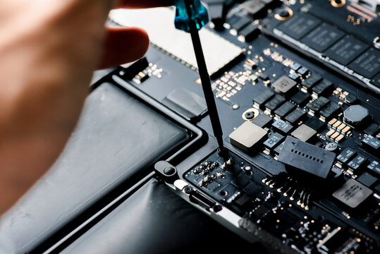 close up of Technician repairing electronic circuit board, repairing, upgrade and technology.