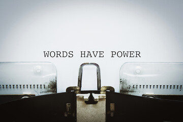“Words Have Power” words typed on a vintage typewriter.