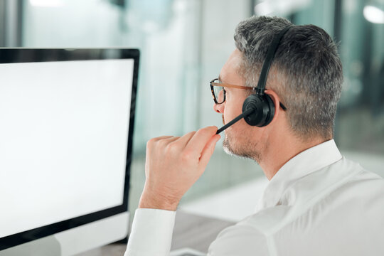 Call center, man and mockup on computer, screen and customer service consulting from the back. Mature salesman, agent and desktop space for telemarketing, CRM advisory and FAQ contact for IT support