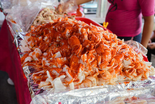 Stall selling cueritos with hot sauce. Typical mexican snack.