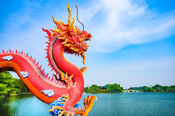 Red dragon statue and lake view in Nakhon Sawan Province