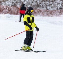 Fototapeta na wymiar Men ski on snow in winter