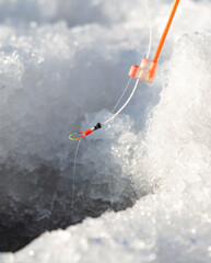 Fishing rod on ice in winter. Ice fishing