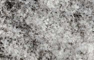 White snowflakes in winter as an abstract background. Texture