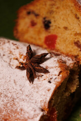 Christmas cake. Christmas stollen with dry fruits, cinnamon, stars, cinnamon sticks, pine twig, nuts. New Year