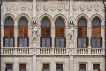 Fototapeta na wymiar Statues and bas relief on the exterior of Hungarian Parliament Building (Hungarian: Országház). Budapest, Hungary - 7 May, 2019