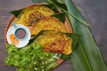 Vietnames Savory Crepe Banh xeos crepes with the sweet smell of turmeric, yellow soft flour and...