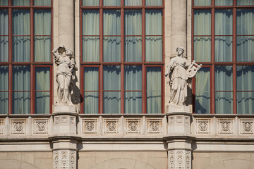 Obraz premium Statues on exterior of a Vigadó (Place for Merrimen) buildlng, Budapest's second largest concert hall, located on the Eastern bank of the Danube. Budapest, Hungary - 7 May, 2019