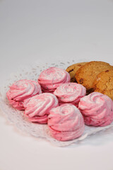 Home-made pink marsh-mallow, zephyr and cookies. Sweets closeup. Marshmallow, Meringue, Zephyr. Valentine's or Mothers Day concept