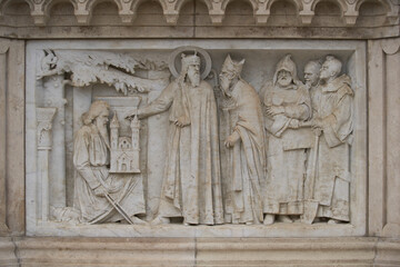 Fototapeta na wymiar Marble stone bas relief on the statue of King Saint Stephen in Fisherman's Bastion. Budapest, Hungary - 7 May, 2019