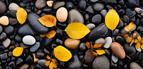 Küchenrückwand glas motiv Black and yellow stones as a backdrop, spa and feel-good atmosphere, round washed pebbles,  © Infini Craft