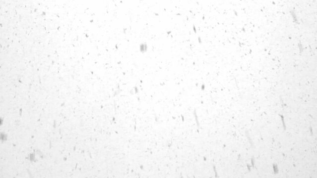 snowfall on a winter day, large flakes of snow falling from the sky close-up