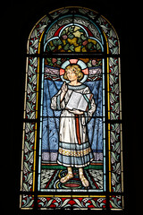 Saint Honore d'Eylau church, Paris, France. Stained glass. Jesus as a child holding the Gospel.