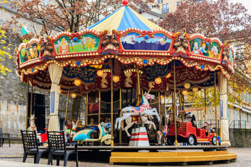 Vintage carousel (merry-go-round) in amusement park